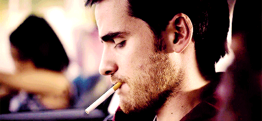 Colin O’Donoghue smoking a cigarette (or weed)
