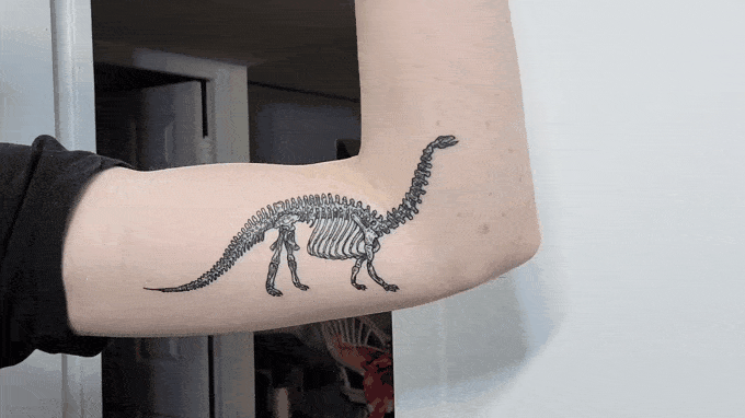 Little dinosaur by @truett_ink next to some of his other healed work! 🦖 . # dinosaur #bones #realistictattoo #ink #dinosaurtattoo #tattoos… | Instagram