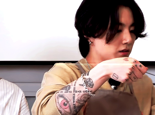 Does Jungkook have an eye tattoo on his arm? - Quora