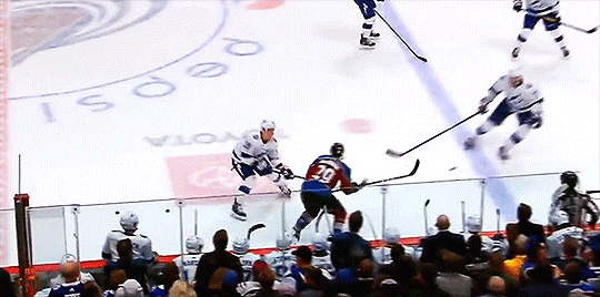Nathan MacKinnon fights after Bowen Byram hit from behind #Avs 